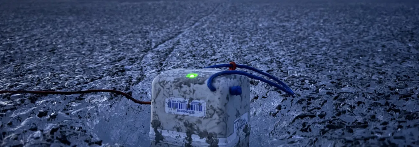 Photo of seismometer embedded in glacier