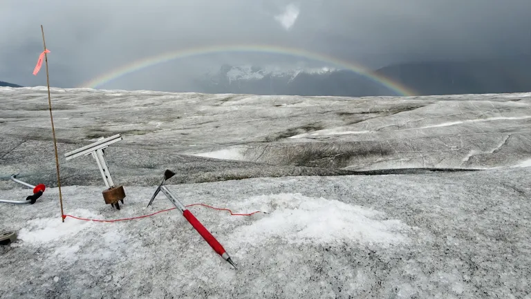 Photo of an ice pick and other tools in glacier