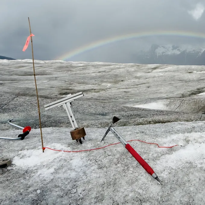 "Photo of an ice pick and other tools in glacier"