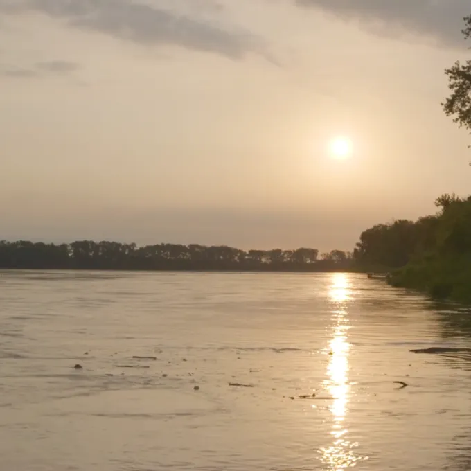 sunrise over a calm river