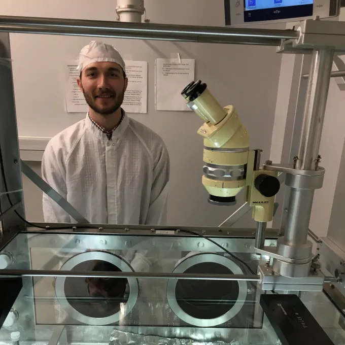 Mason Neuman with lunar core sample