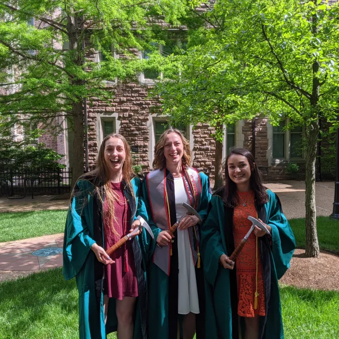 Graduating seniors Maia Cohen, Ellie Moreland, and Olivia Shaw receive rock hammers on May 21, 2021